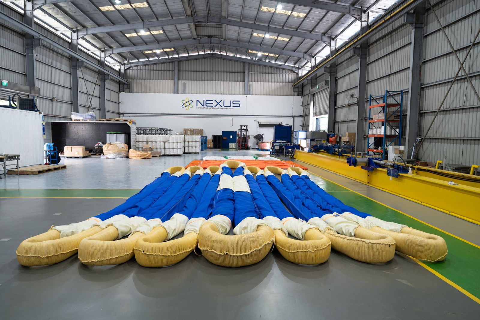 The NEXUS CORE facility in Singapore, with blue round slings laid out on the factory floor