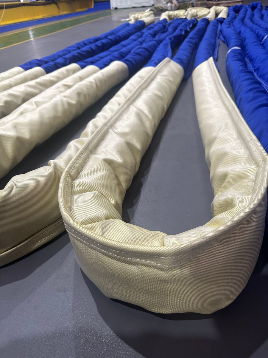 Round sling cover and bearing-point sleeve